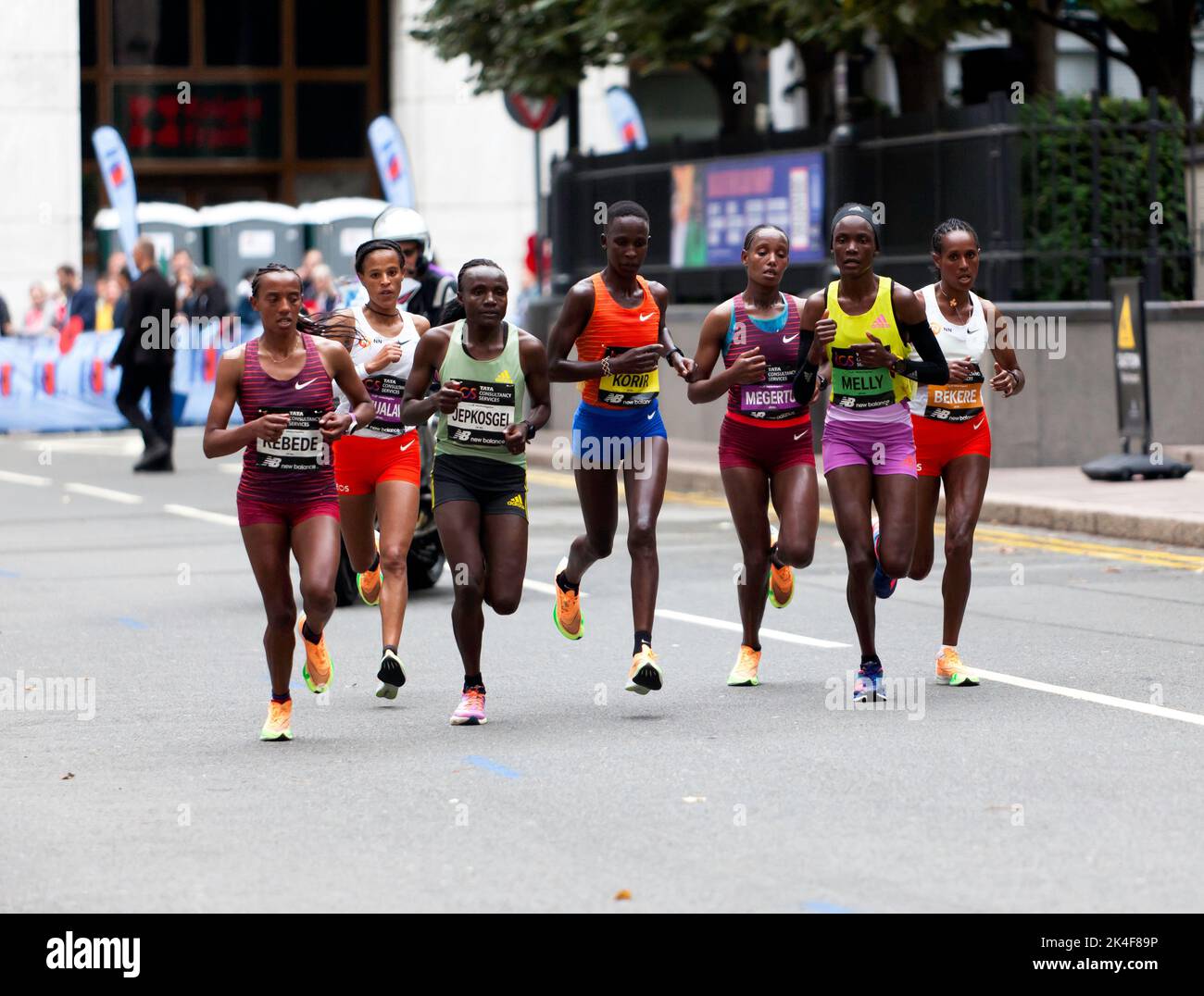 London, 2nd October 2022, Womens Elite Runners, including  Sutume Kebede, Joyciline Jepkosgei, Joan Melly, Yalemzerf Yehualaw,  Judith Korir, Alemu Megertu and  Ashete Bekere,  pass through Cabot Square, during the 2022 London Marathon.  Yalemzerf Yehualaw went on to win the event in a time of 2:17:26; Credit John Gaffen/Alamy Live News Stock Photo