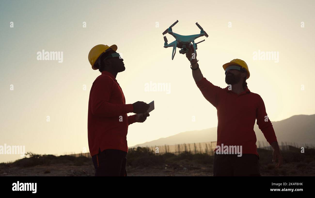 Drone engineers working on construction site - Aerial engineering concept Stock Photo