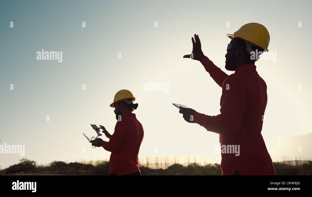 Drone engineers working on construction site Aerial engineering concept Stock Photo Alamy