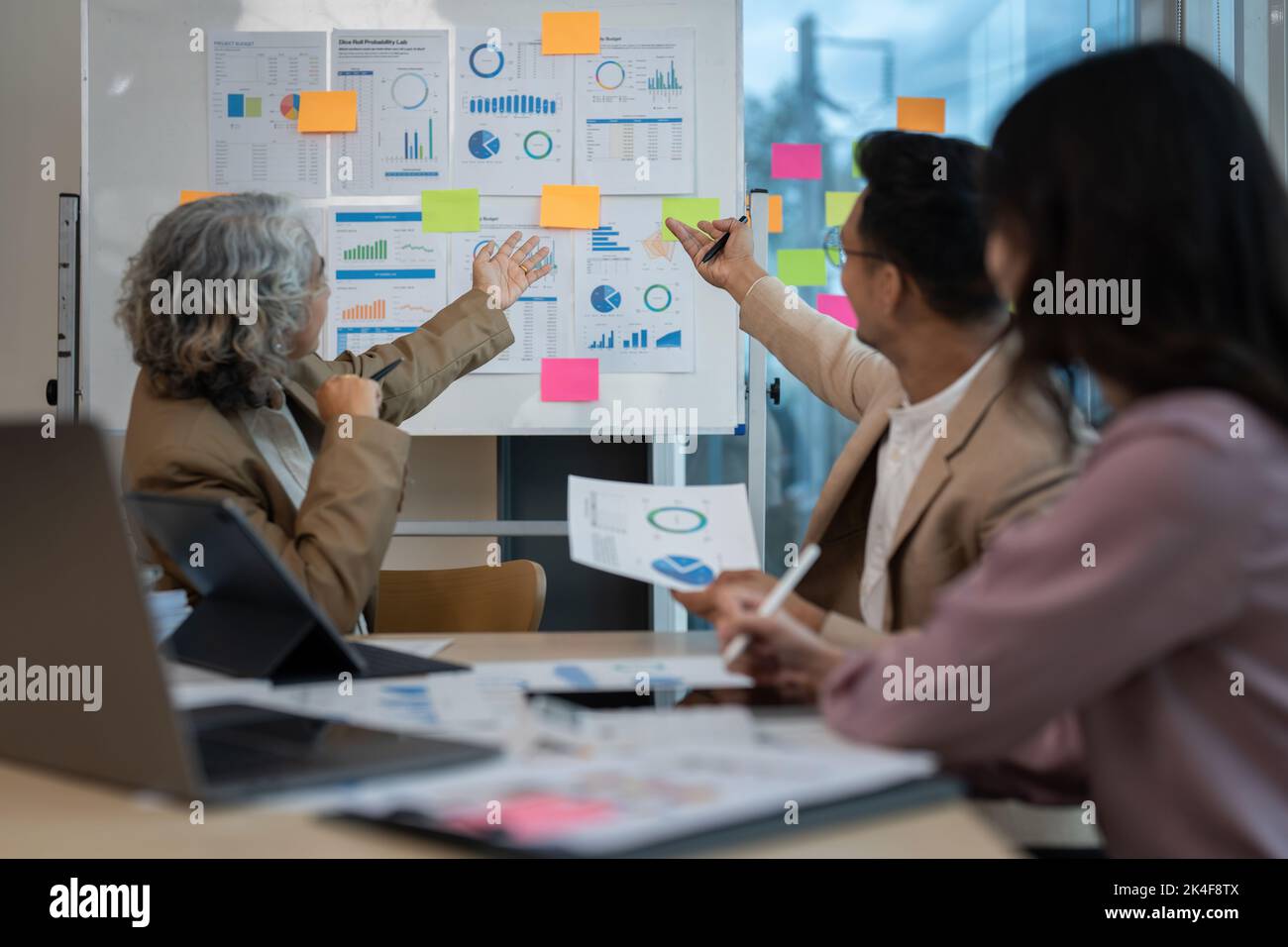 Group of Business people discuss a marketing strategy to improve the