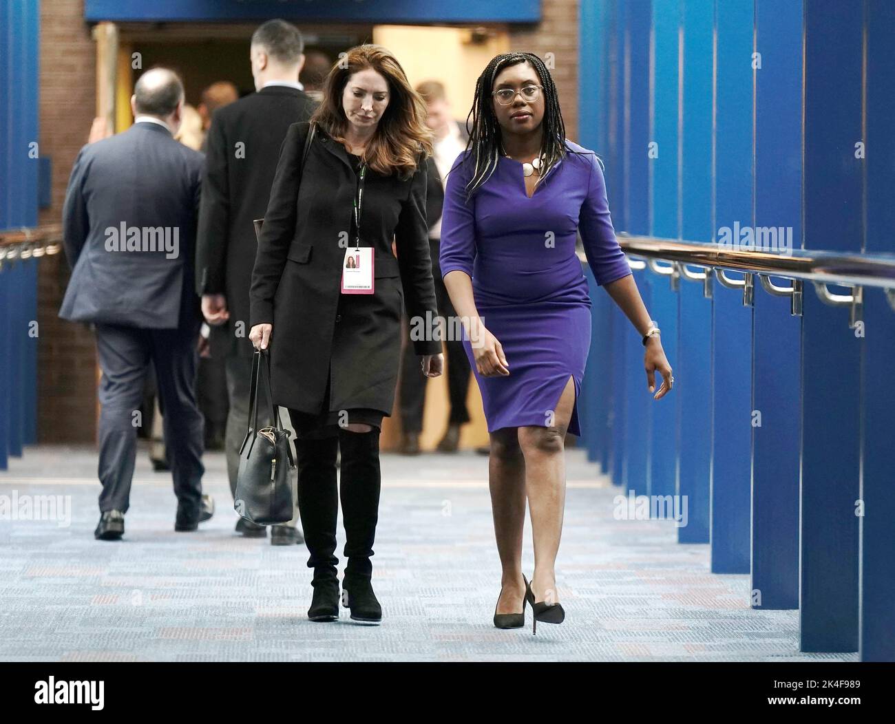 Secretary of State for International Trade of United Kingdom Kemi Badenoch (right), walks across the Hyatt hotel bridge at the Conservative Party annual conference at the International Convention Centre in Birmingham. Picture date: Sunday October 2, 2022. Stock Photo