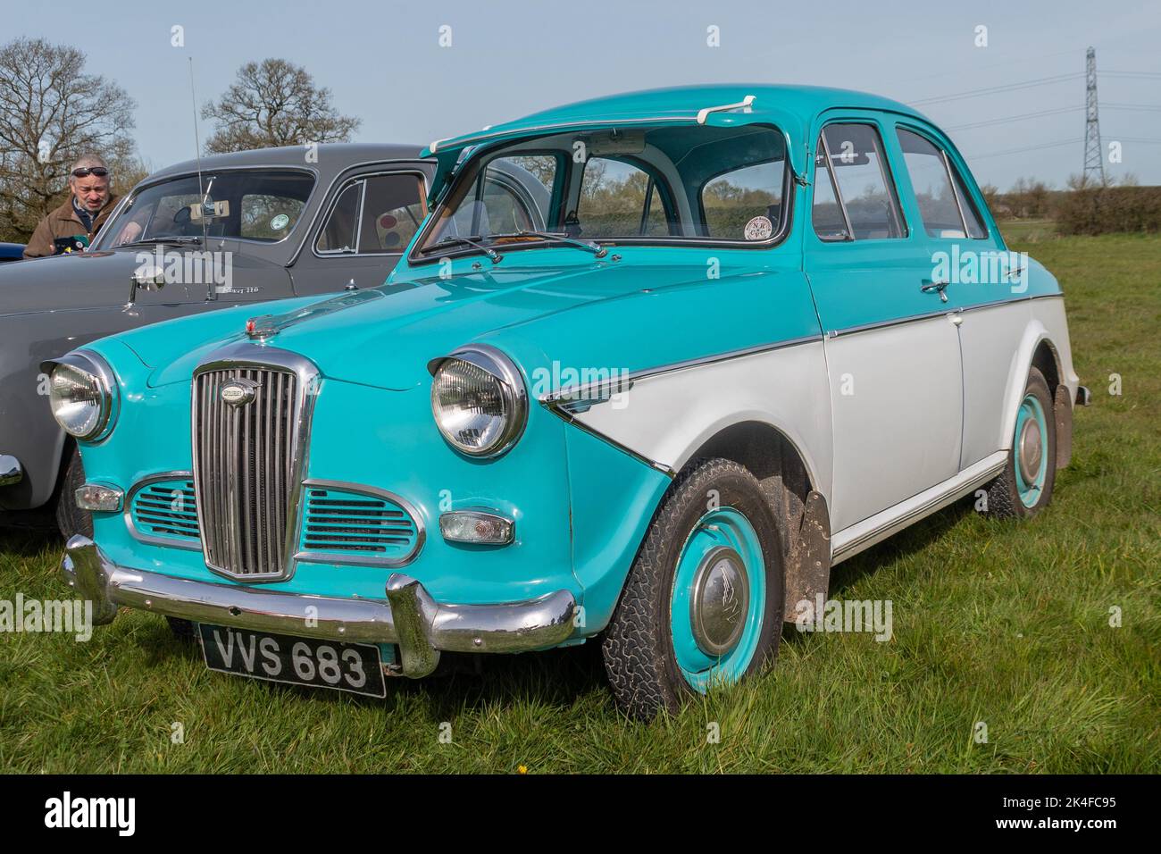 A front 3/4 angle view of a light blue and white 1960 Wolseley 1500