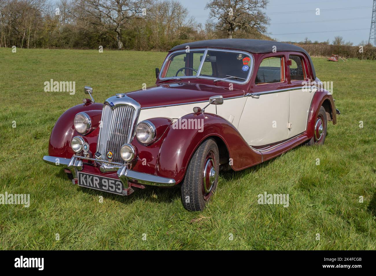 A front 3/4 angle view of a 1948 Riley RM A, parked on the grass at a