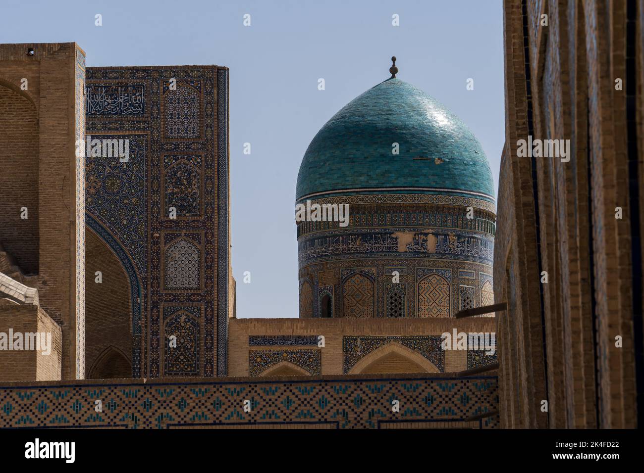 Zoom of Mir-i-Arab madrassa blue-tiled dome from courtyard of Kalan Mosque, Bukhara Old Town Stock Photo