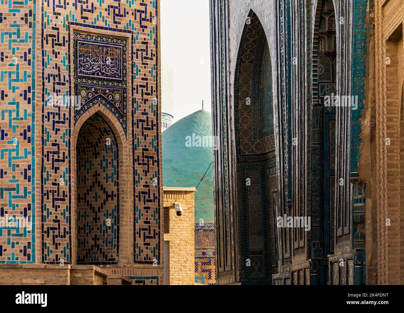 Zoom of patterns and textures of the golden and blue tiled domes in Shah-i-Zinda at sunset, Samarkand Stock Photo