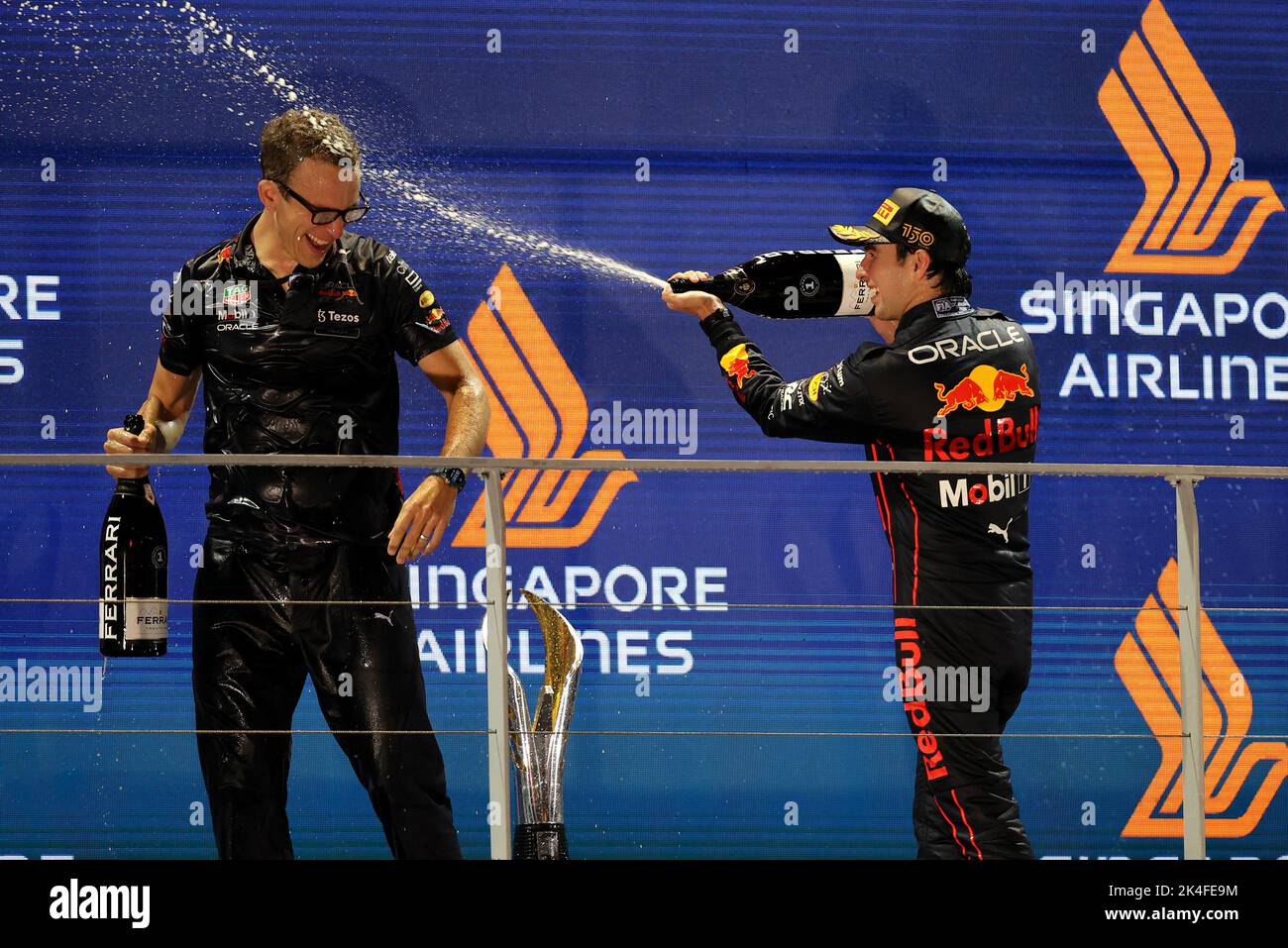(L to R): Hugh Bird (GBR) Red Bull Racing Engineer celebrates on the podium with race winner Sergio Perez (MEX) Red Bull Racing. Singapore Grand Prix, Sunday 2nd October 2022. Marina Bay Street Circuit, Singapore. Stock Photo
