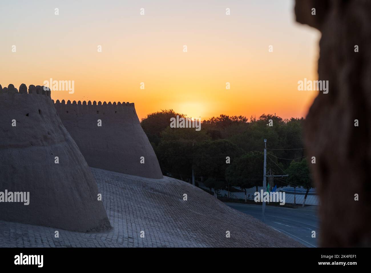 Khiva city walls at Dusk sunset Stock Photo