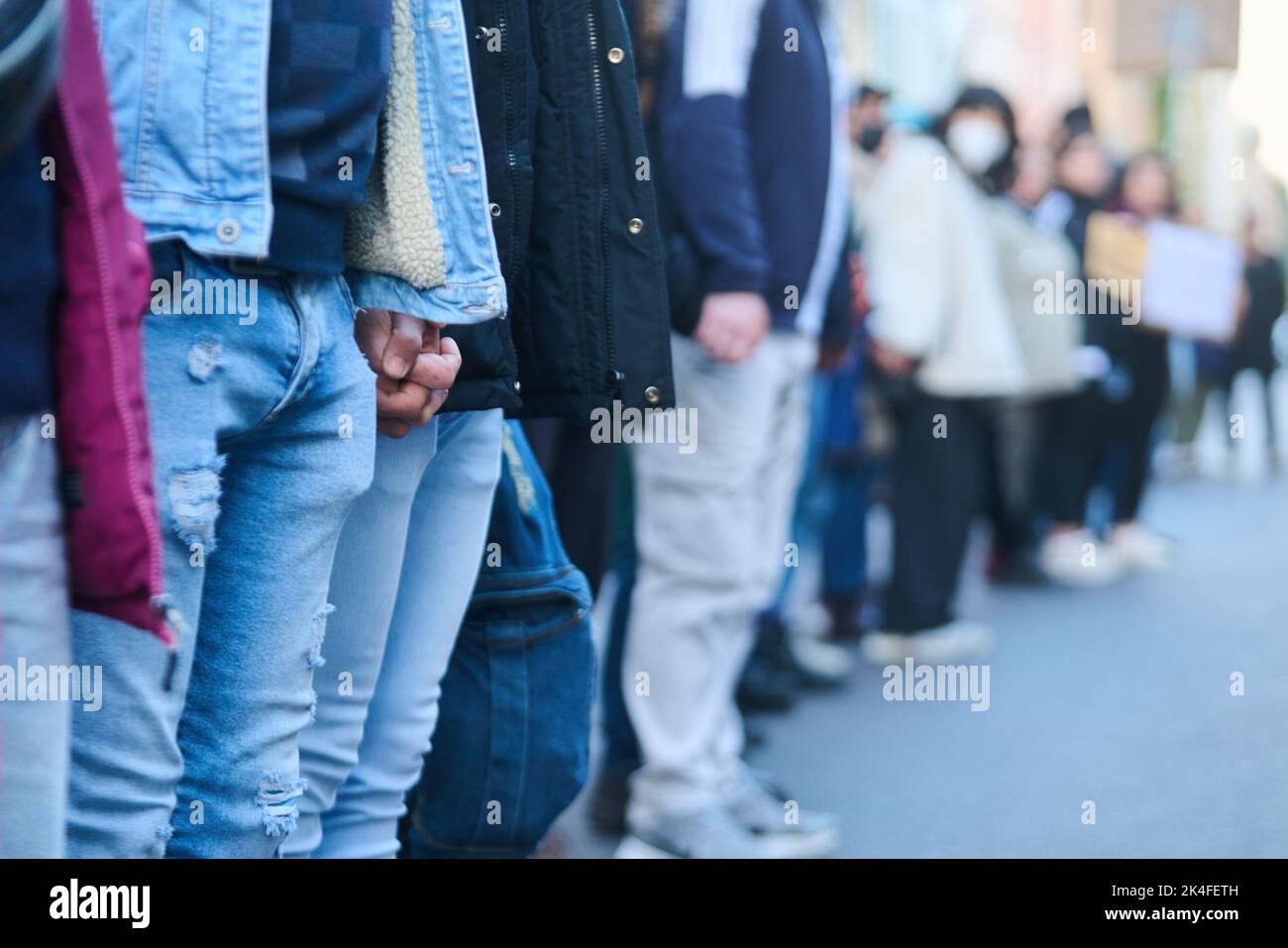 Berlin, Germany. 02nd Oct, 2022. Demonstrators hold hands and shout ...
