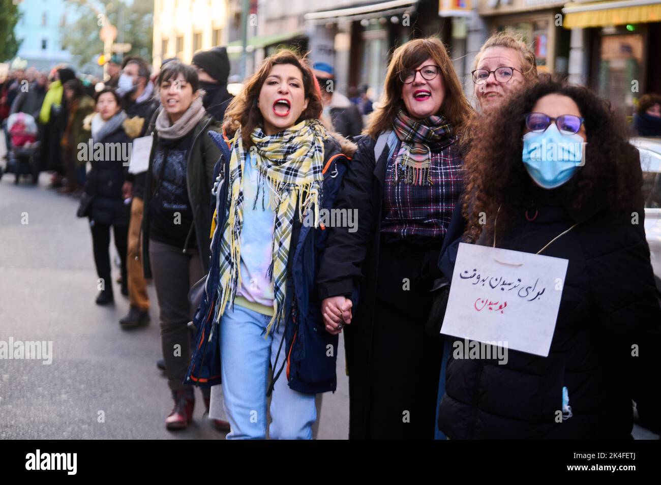 Berlin, Germany. 02nd Oct, 2022. Demonstrators hold hands and shout ...