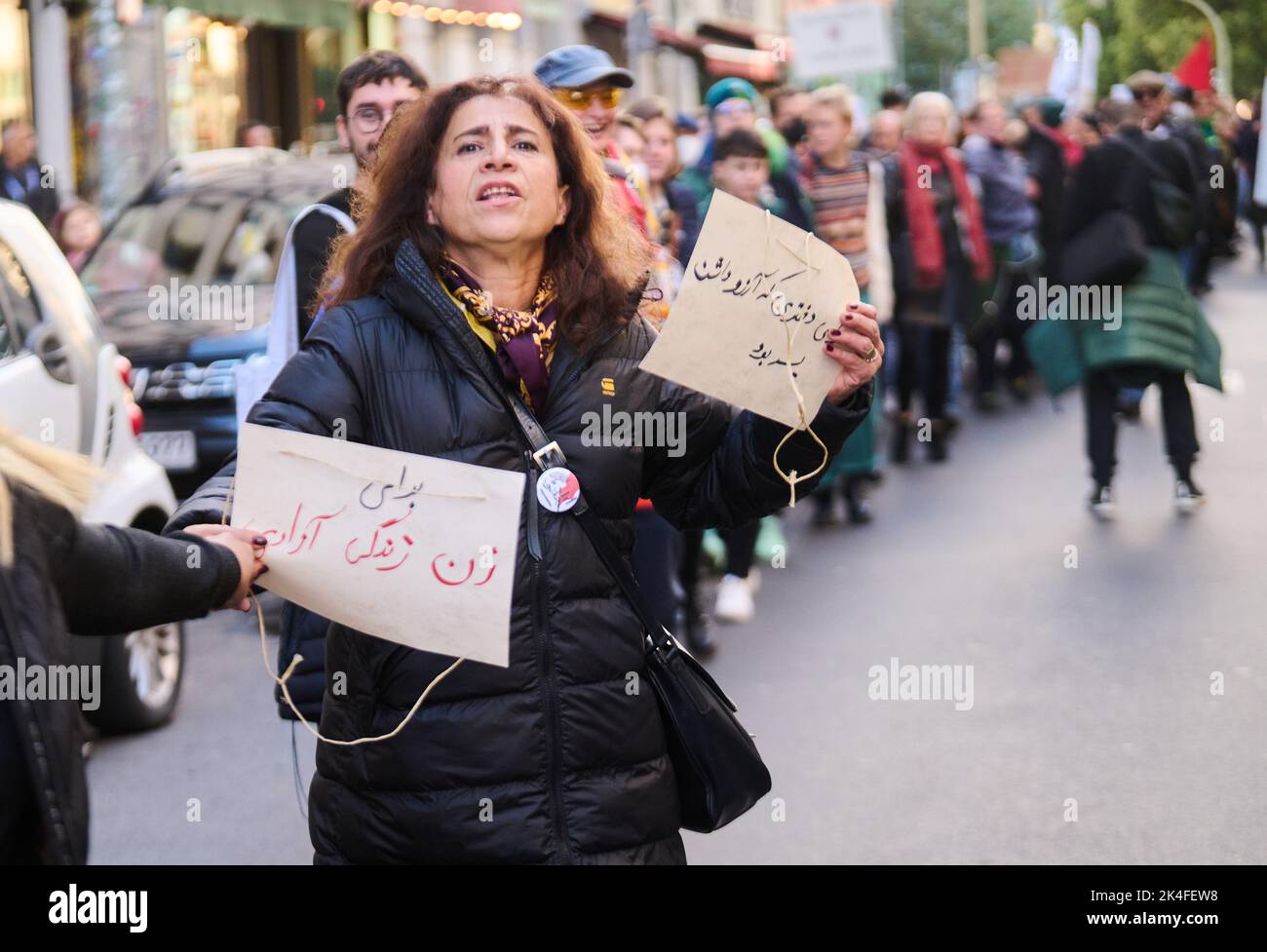 Berlin, Germany. 02nd Oct, 2022. Demonstrators hold hands and shout ...