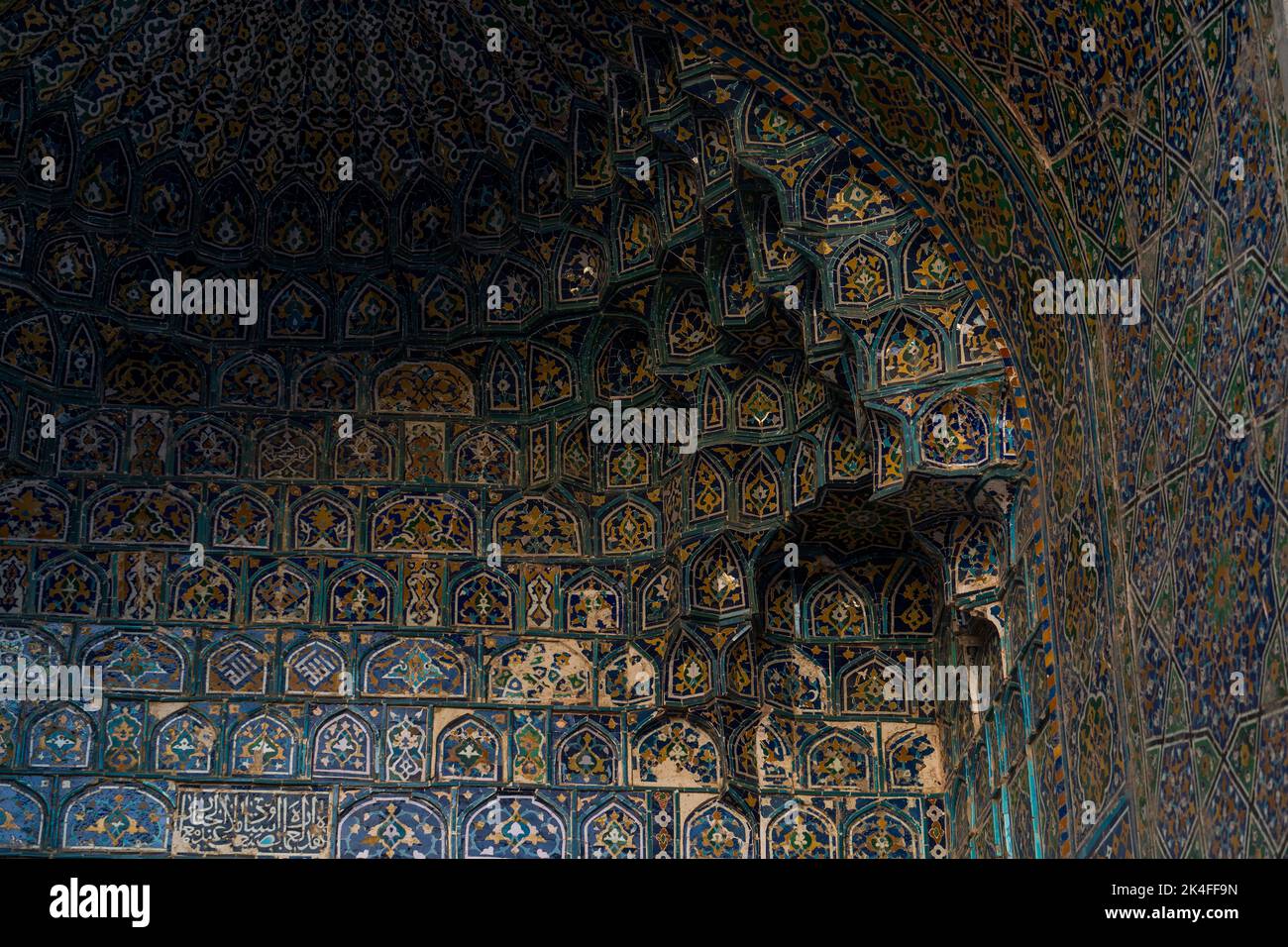 Registan intricate blue tile arch vault of Tilla Kari Madrassa at sunset, Samarkand Stock Photo