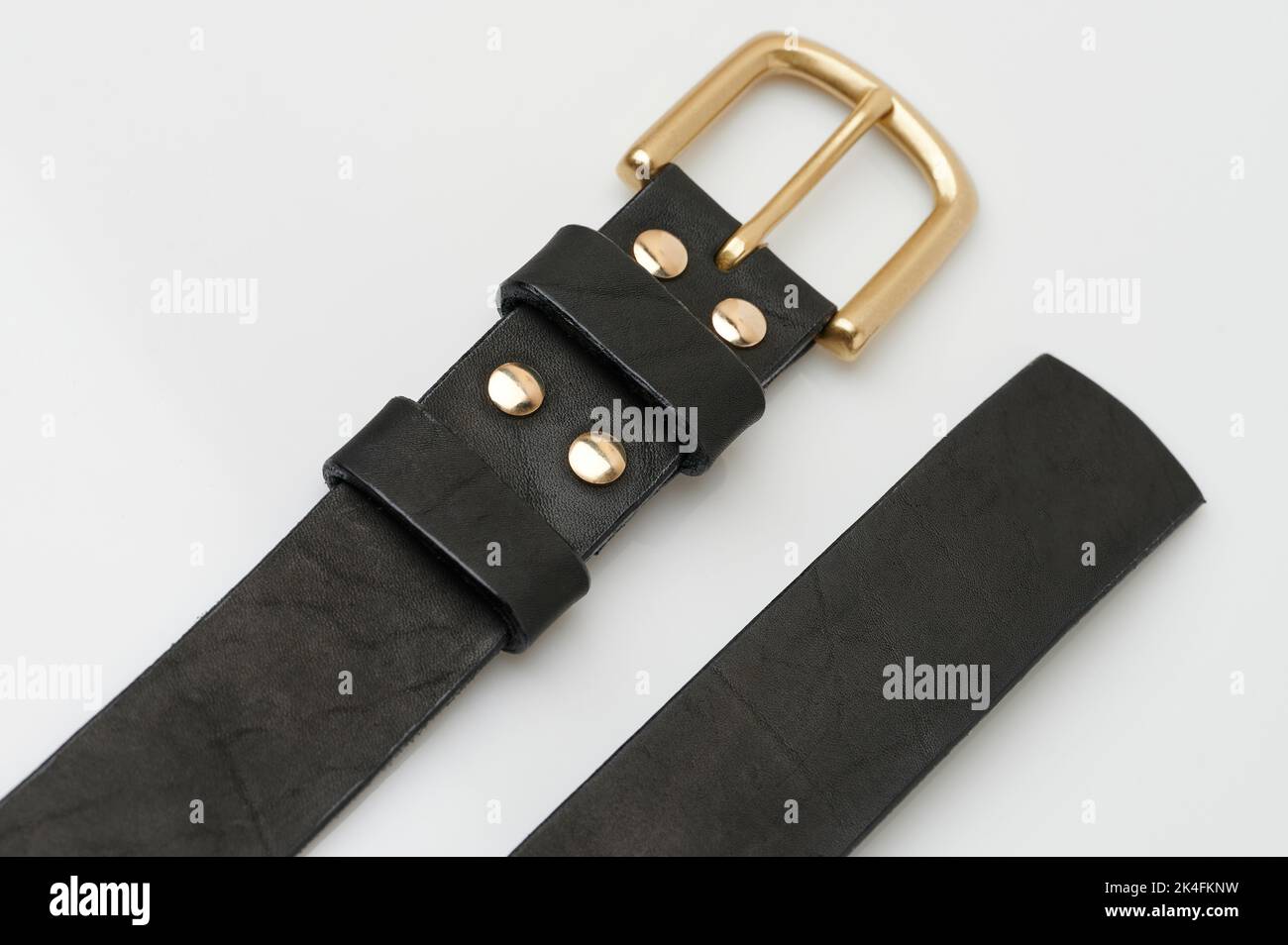 Clean leather men belt isolated on studio background close up view Stock Photo