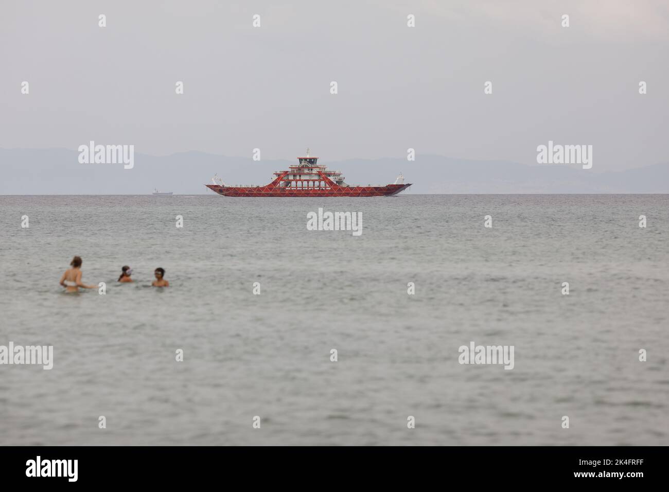 Thassos, Greece - August 25, 2022: Ferryboat taking people and their cars from continental Greece to the island of Thassos in the Thracian Sea. Stock Photo