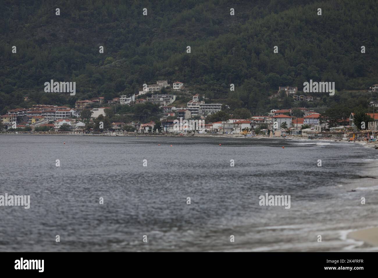 Thassos, Greece - August 25, 2022: Golden Beach (Skala Potamia) during a cloudy summer morning after a powerful storm hit the island a night before. Stock Photo