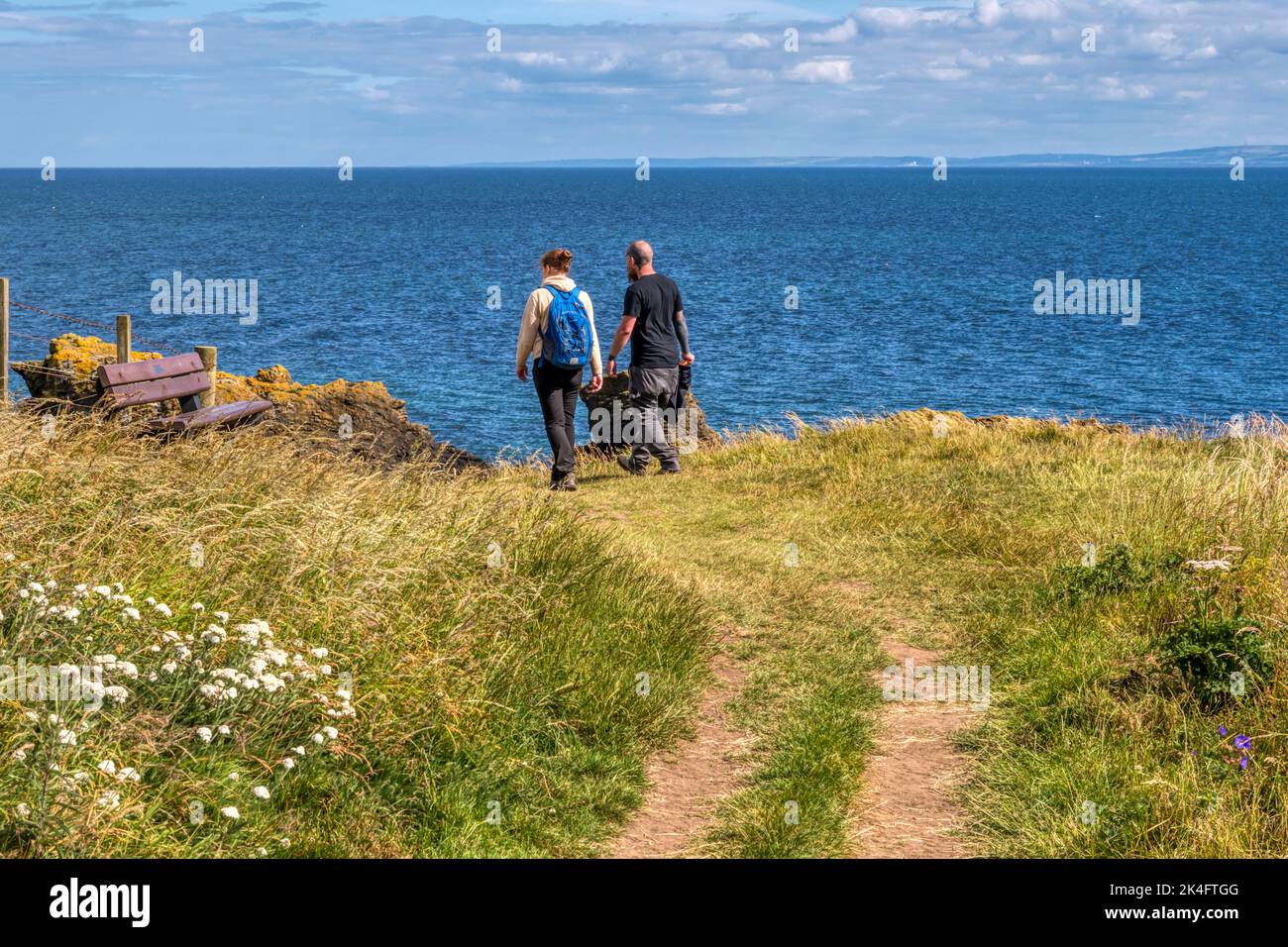 People walking the Fife Coastal Path at St Monans in the East Neuk of