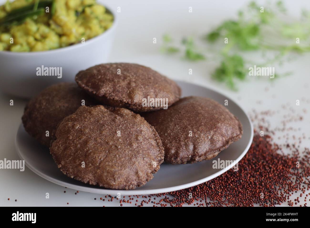 Ragi Poori served with spiced mashed potatoes as side dish. Deep fried