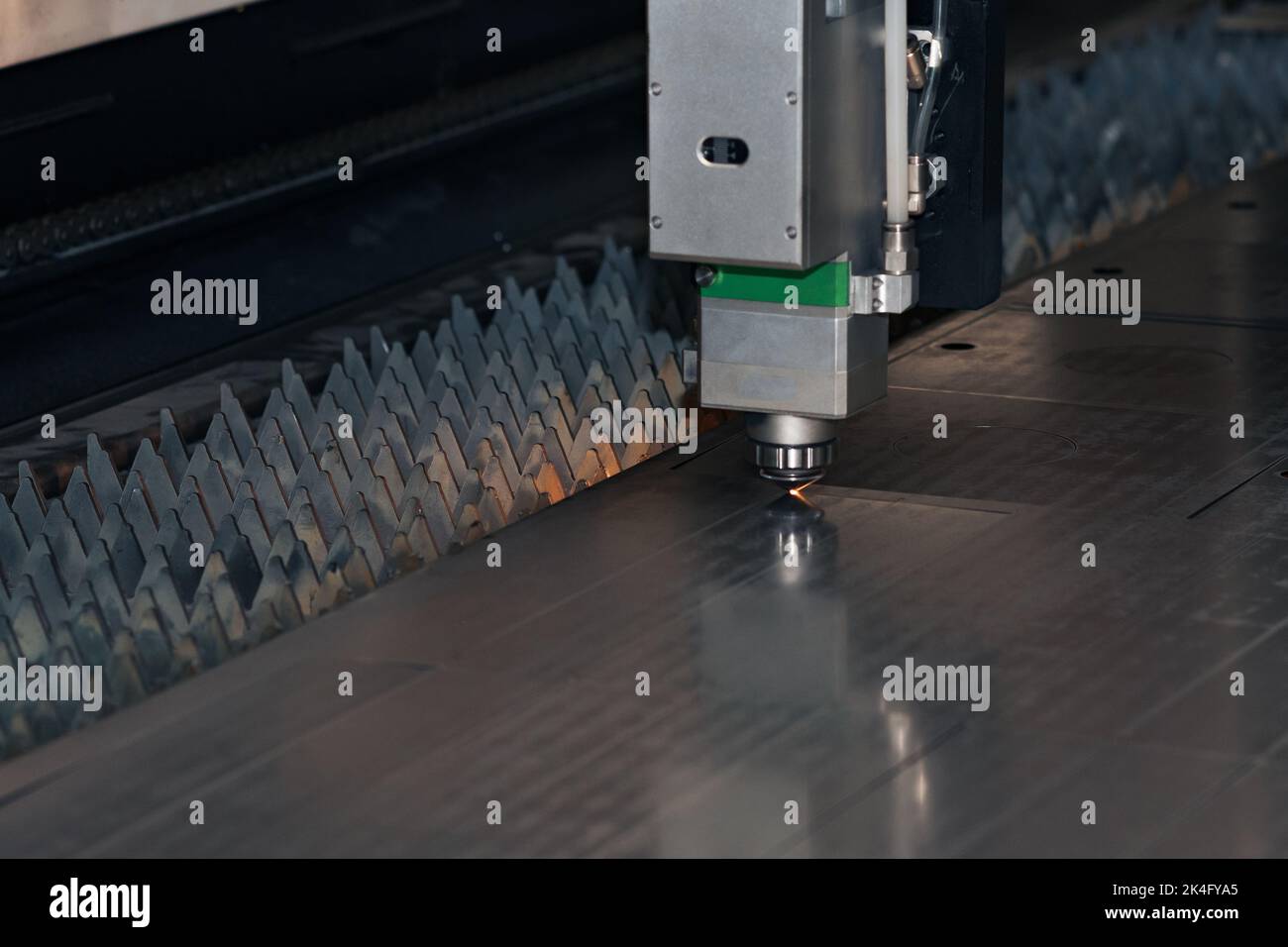industrial laser cutter during metal sheet processing Stock Photo