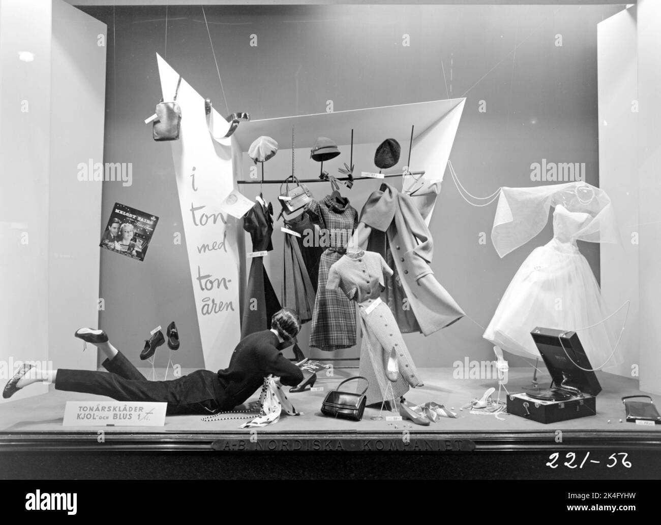 Shop window at the Nordic Company. "In tone with teens". Teenage fashion dresses, blouses, skirts, coats, accessories and turntables. Nordic Stock Photo