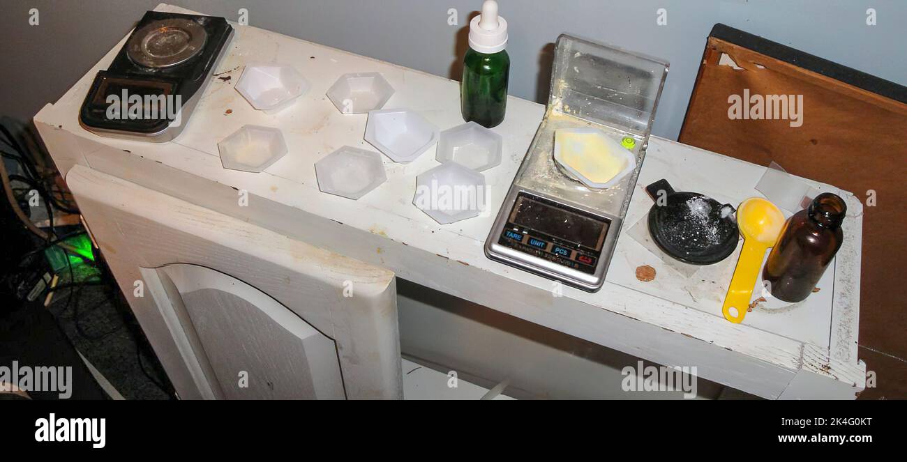 Suspected Fentanyl cutting table at drug house Stock Photo