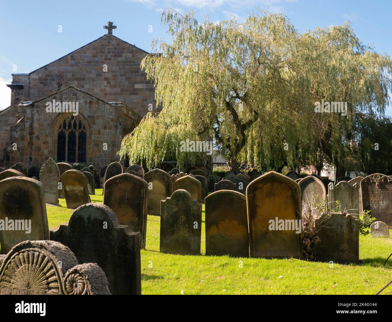 Gravestones in the churchyard of the Parish Church of St Peter and St Paul in Stokesley North Yorkshire England Stock Photo