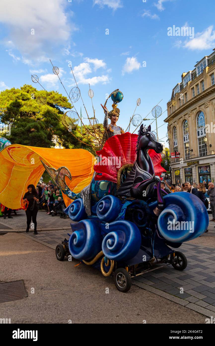Bournemouth, Dorset UK. 2nd October 2022.  Carnival by the Sea festival parade, takes place as part of the Arts by the Sea Festival,  with over 250 community performers taking part.  With giant puppets, fabulous Carnival costumes, funky drumbeats, colourful flags and high energy dance choreography, a wonderful finale to the festival weekend, as crowds turn out to watch the parade wind its way through the streets and gardens of central Bournemouth. Credit: Carolyn Jenkins/Alamy Live News Stock Photo