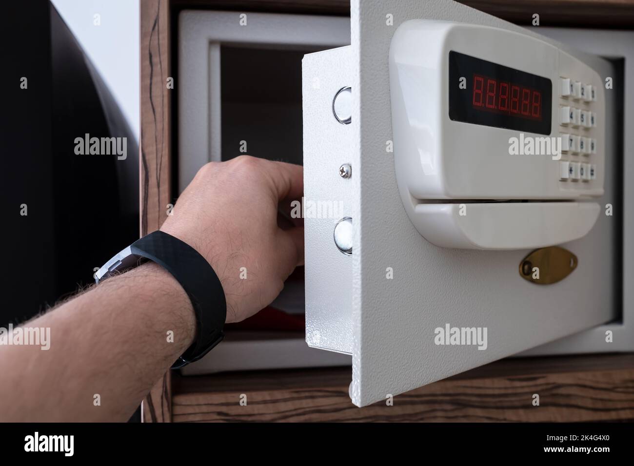 strongbox safe with buttons in a hotel room on a shelf Stock Photo - Alamy