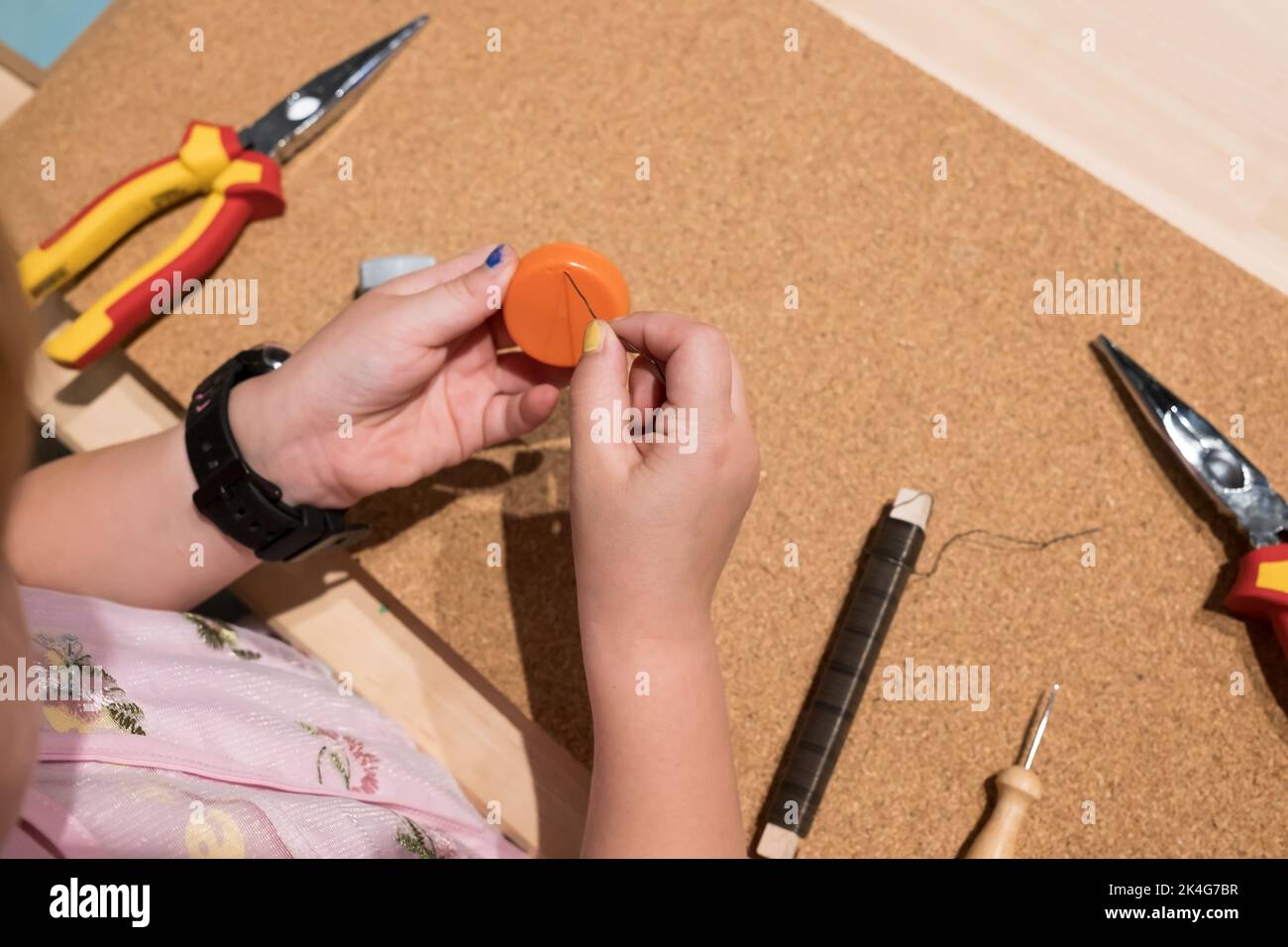 children creativity master class of crafts from bottle caps Stock Photo ...