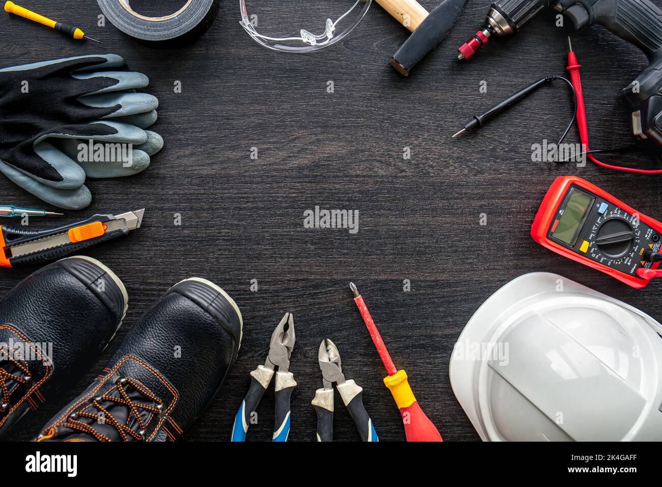 Different electrical tools on wooden background, flat lay. Stock Photo