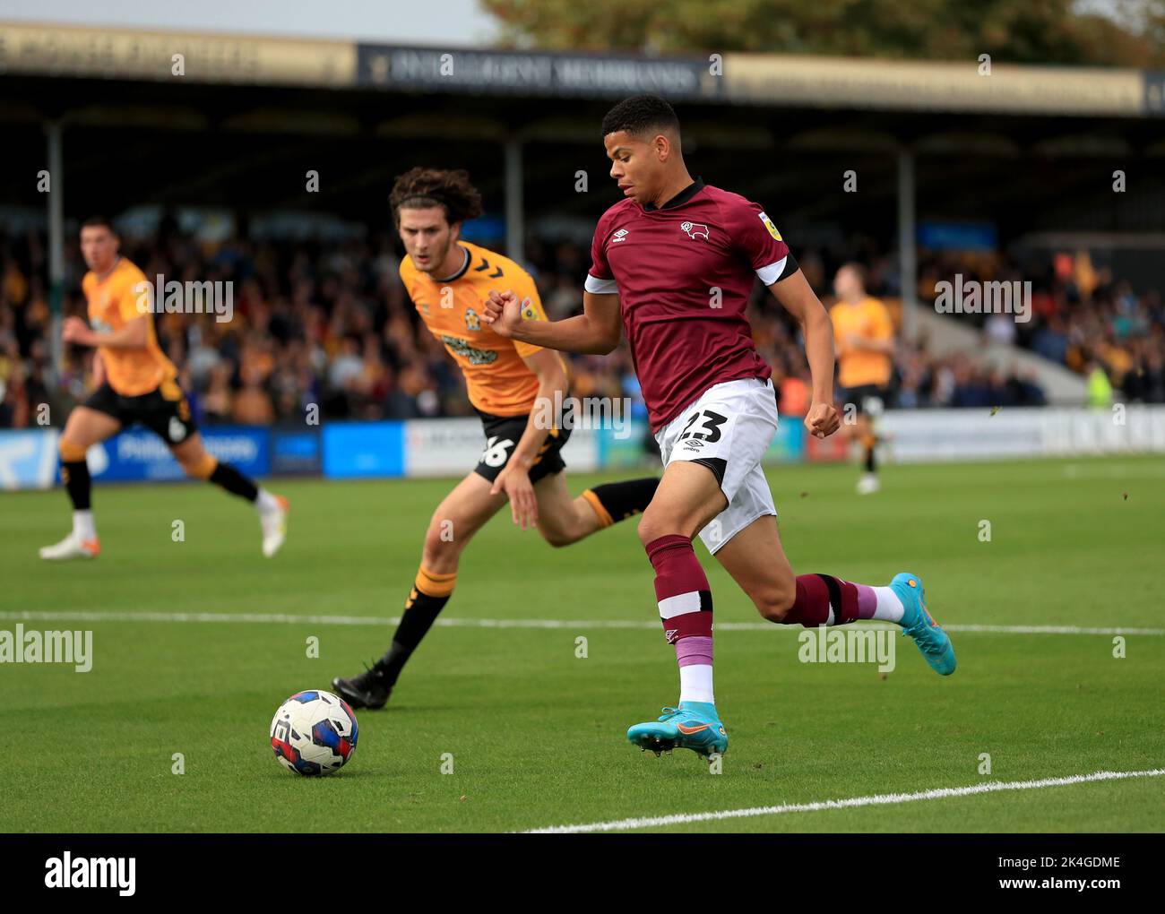 Cambridge United's Zeno Rossi (left) and Derby County's William Osula battle for the ball during the Sky Bet League One match at Abbey Stadium, Cambridge. Picture date: Saturday October 1, 2022. Stock Photo