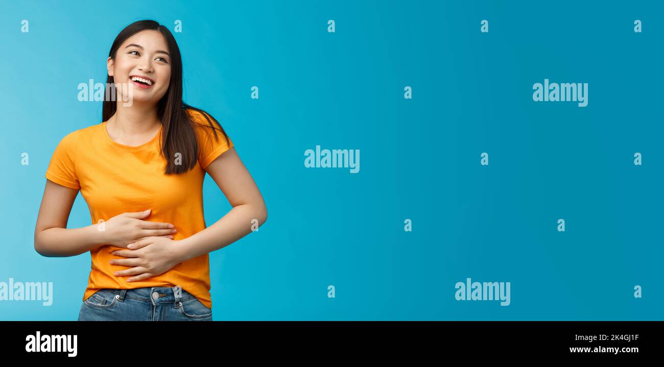 Happy staffed cute asian girl feelings satisfaction after eating