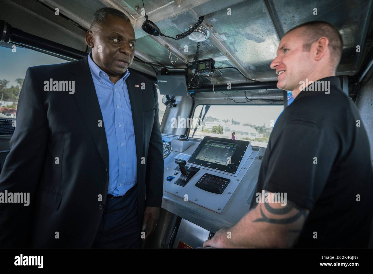 San Diego, United States of America. 28 September, 2022. U.S. Secretary of Defense Lloyd J. Austin III, tours the pilot house of an Unmanned Surface Vehicle Sea Hunter during a visit to Naval Station Point Loma, September 28, 2022 in San Diego, California. Credit: Chad J. McNeeley/DOD/Alamy Live News Stock Photo