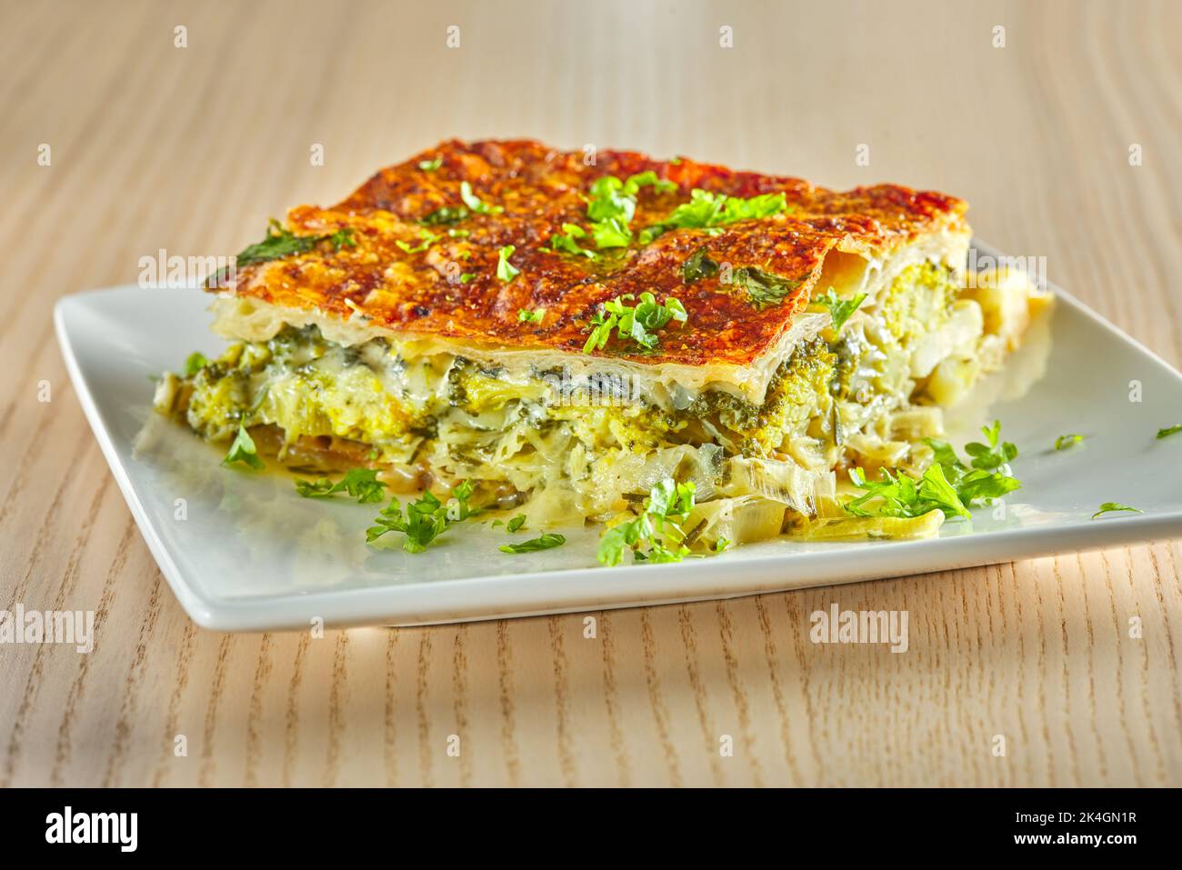 Pie made from broccoli, cheese, cream  and leek - close up view Stock Photo