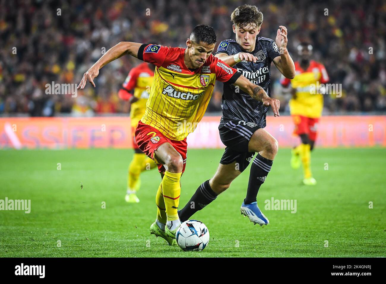 Florian SOTOCA of Lens and Johann LEPENANT of Lyon during the French championship Ligue 1 football match between RC Lens and Olympique Lyonnais (Lyon) on October 2, 2022 at Bollaert-Delelis stadium in Lens, France - Photo Matthieu Mirville / DPPI Stock Photo