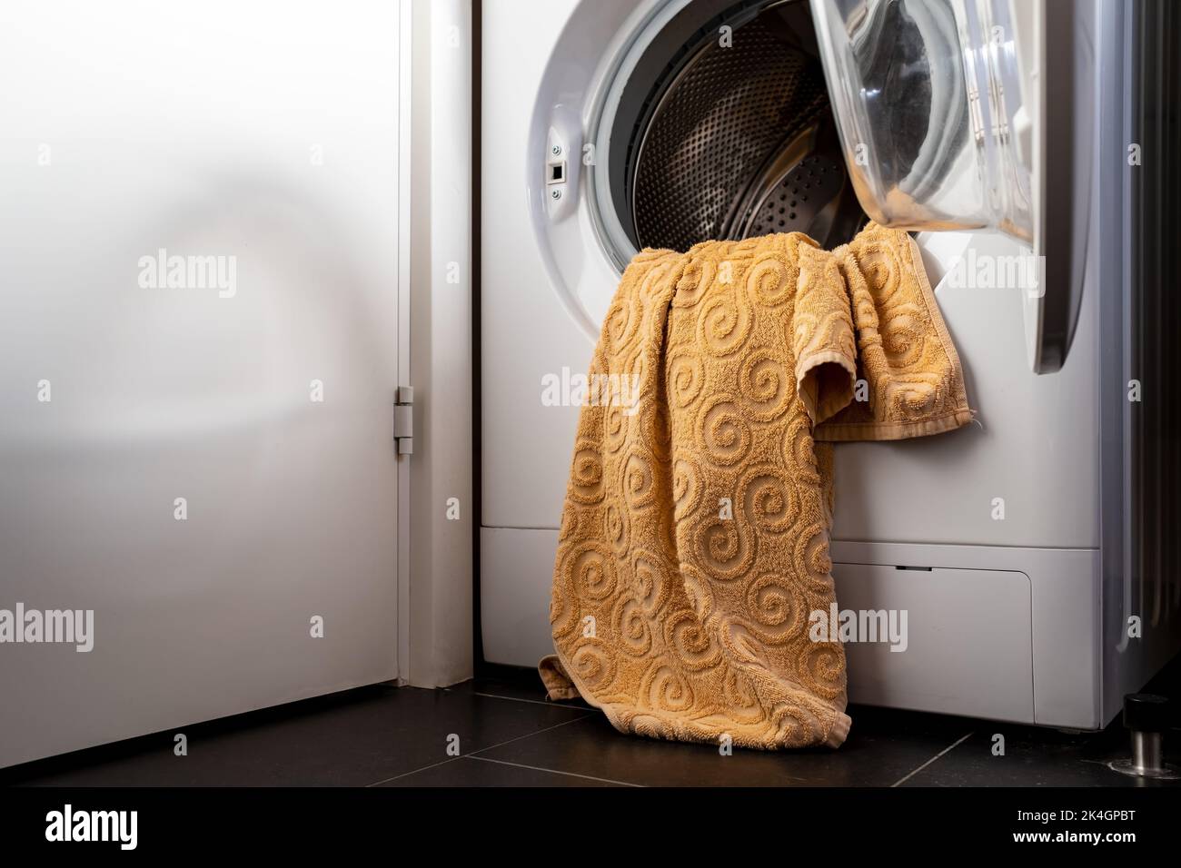 laundry in an open washing machine in the bathroom Stock Photo Alamy