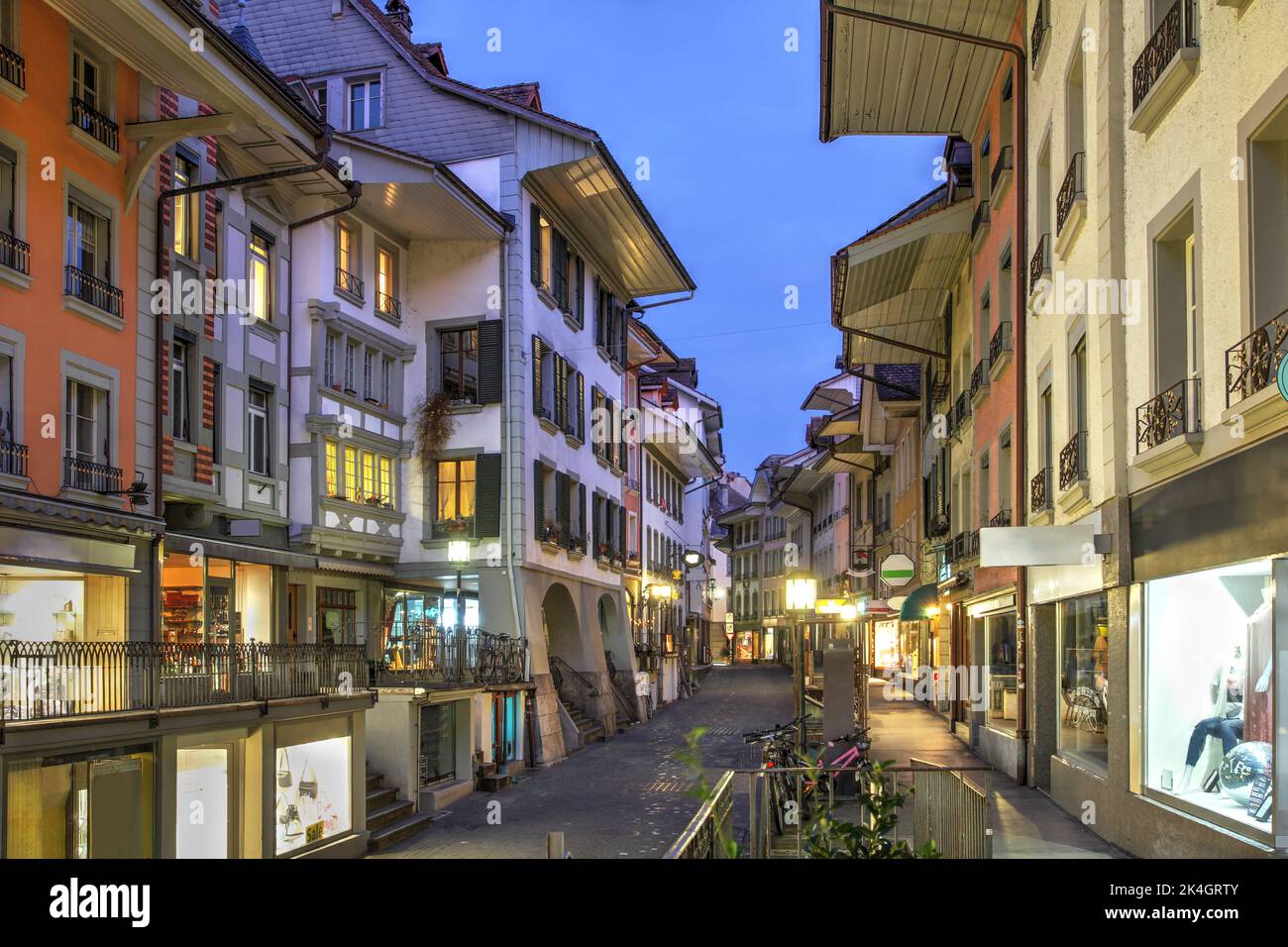 Historic Obere Hauptstrasse (Street) in the old town of Thun, Bern Canton, Switzerland. The commercial street runs parallel to the Aare river and is p Stock Photo