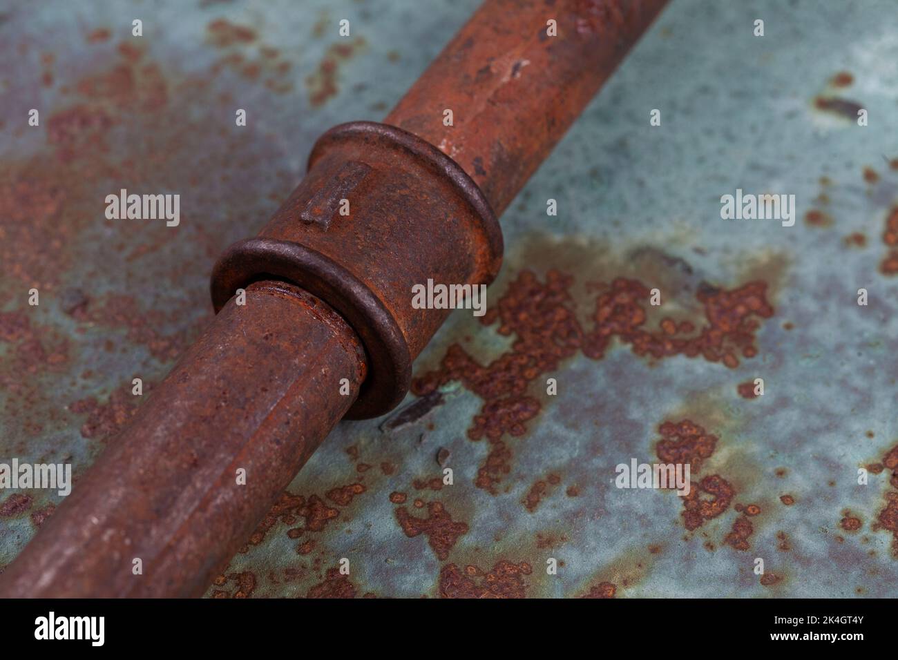 Old rusty valve pipes on rusty metal wall background Stock Photo - Alamy