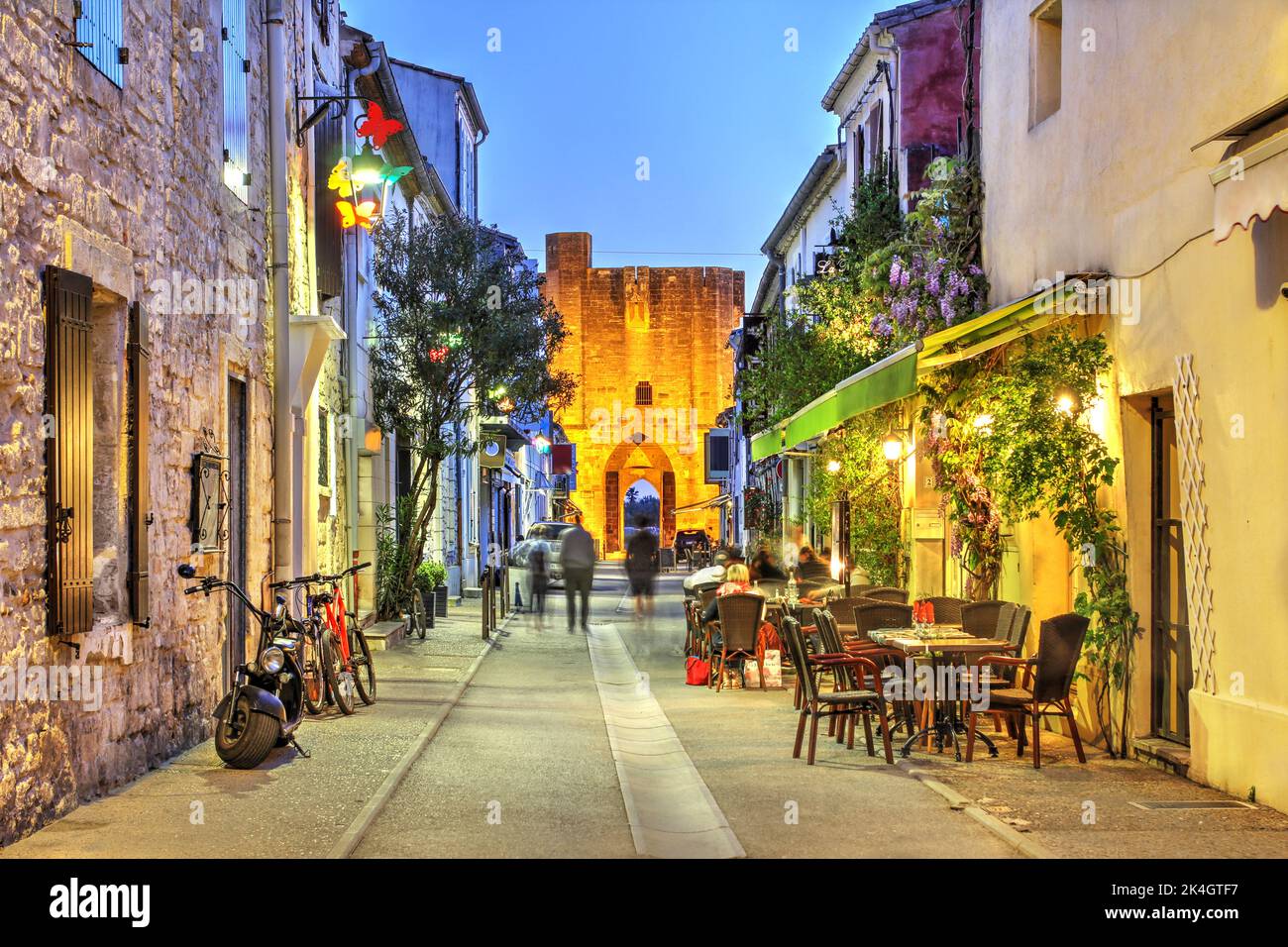 Street leading to Organeau Gate in Aigues-Mortes, Camargue, Occitanie, France at night. Stock Photo