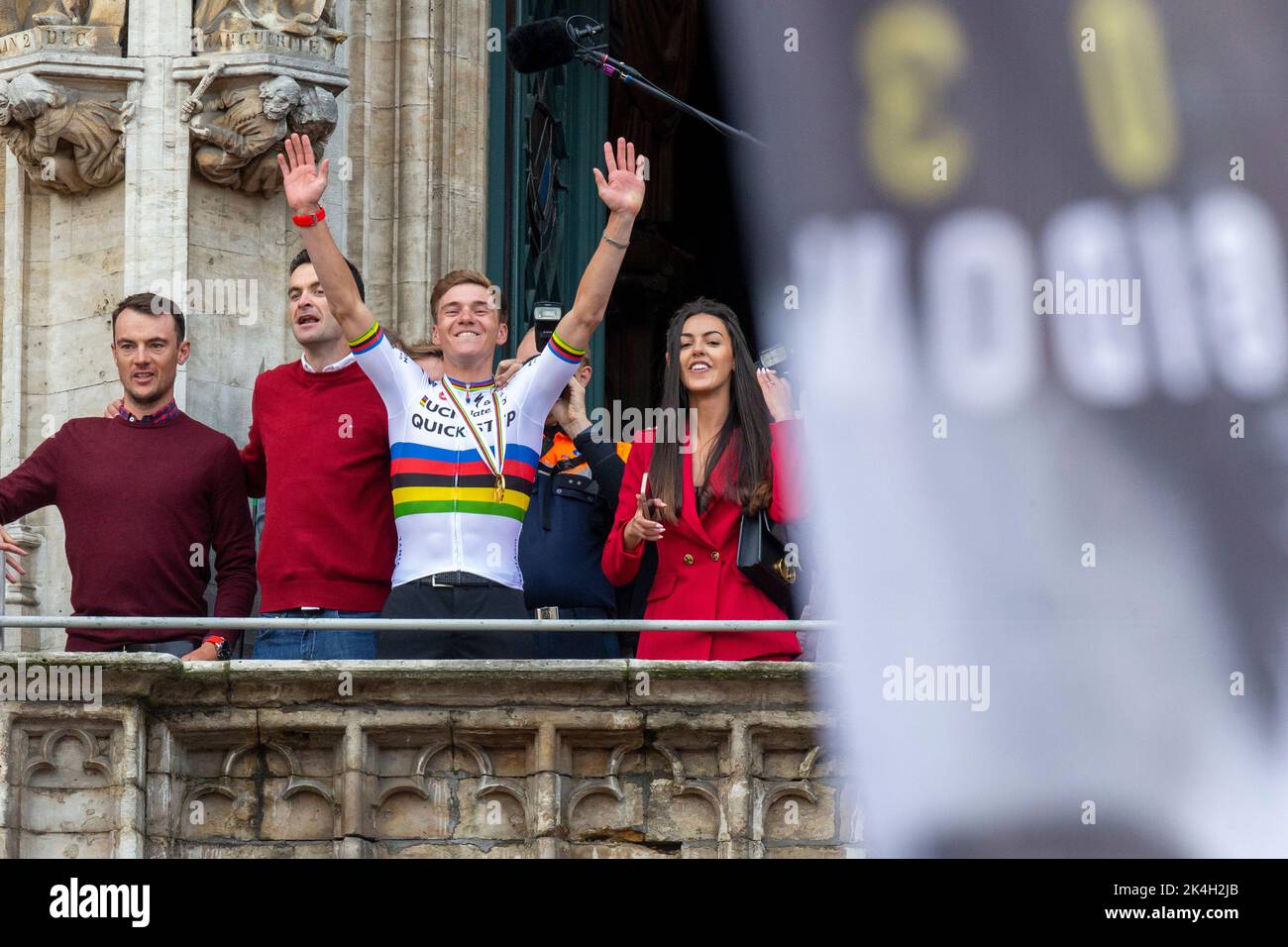 Remco Evenepoel and his partner Oumaima Oumi Rayane pictured at the celebration on the balcony of Brussels city hall on the Grand-Place - Grote Markt, with cycling world champion, Sunday 02 October 2022, part of the celebration of world champion Evenepoel, the 22 years old, from Schepdael, Dilbeek, became world champion after a great season with a win at the Vuelta, first Belgian in 44 years to win a big tour, the Vuelta. BELGA PHOTO NICOLAS MAETERLINCK Stock Photo