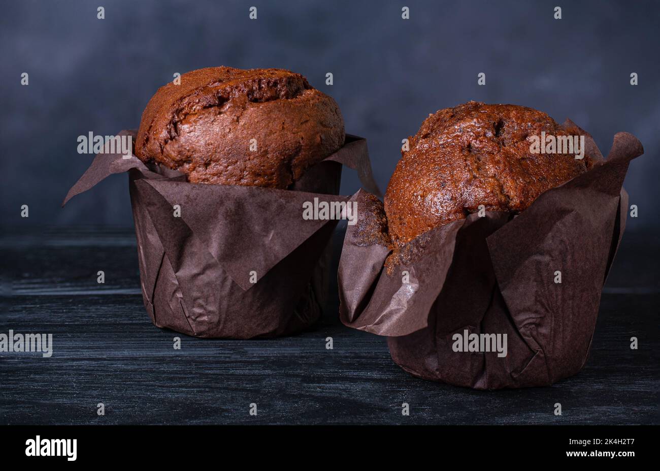 chocolate muffins on a dark background Stock Photo
