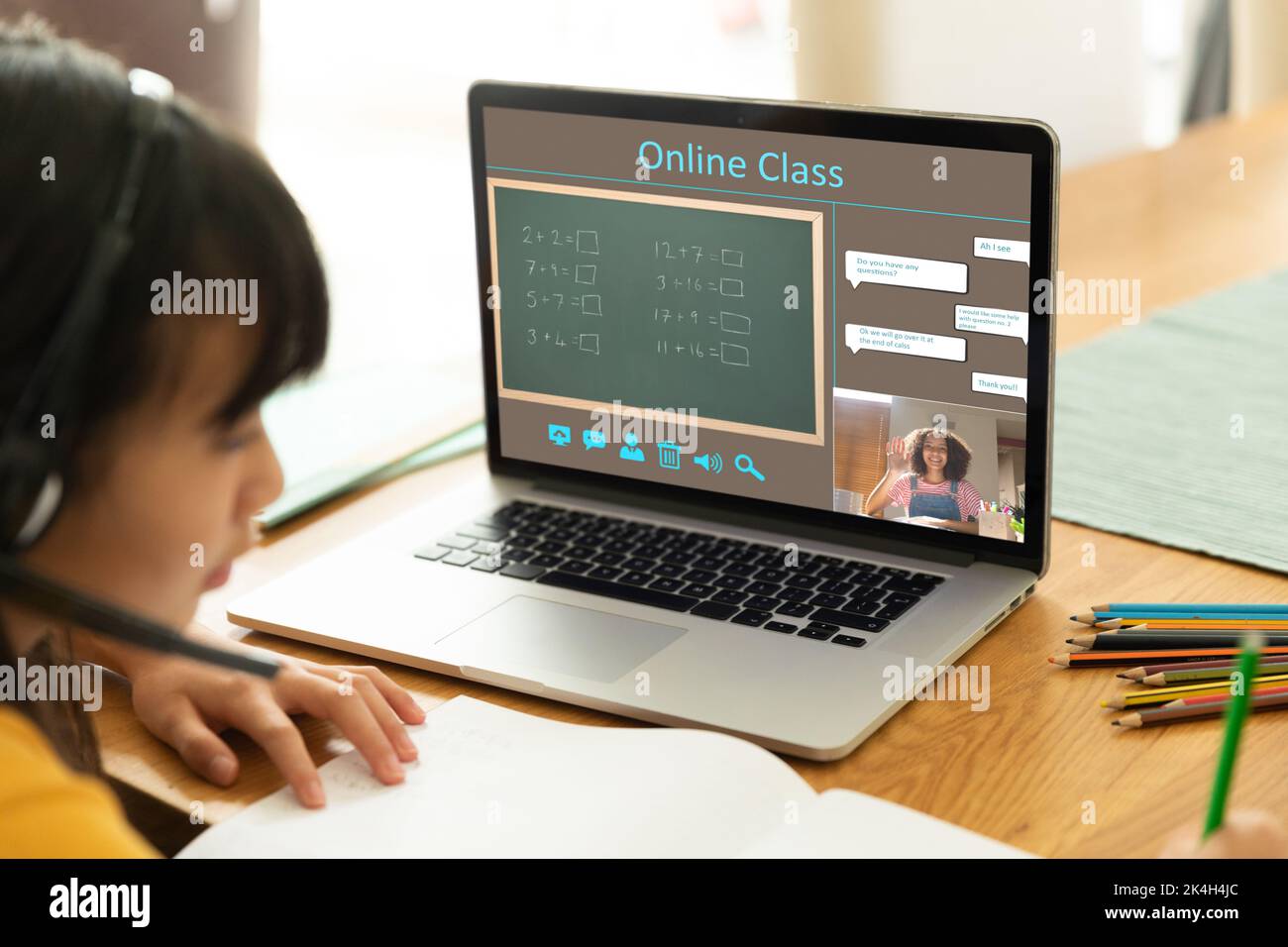 Asian girl using laptop for video call, with smiling biracial female ...