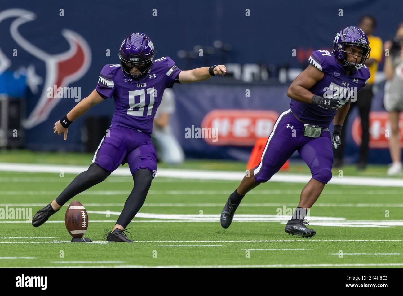 Stephen F. Austin Lumberjacks place kicker Dylan Brown (81) kicks off after a score against the Sam Houston State Bearkats, Saturday, Oct. 1, 2022, in Stock Photo