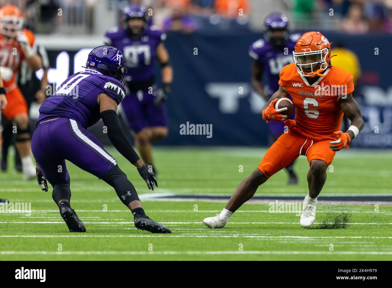 Sam Houston State Bearkats wide receiver Noah Smith (6) looks to run after the catch as Stephen F. Austin Lumberjacks safety Myles Heard (0) defends, Stock Photo