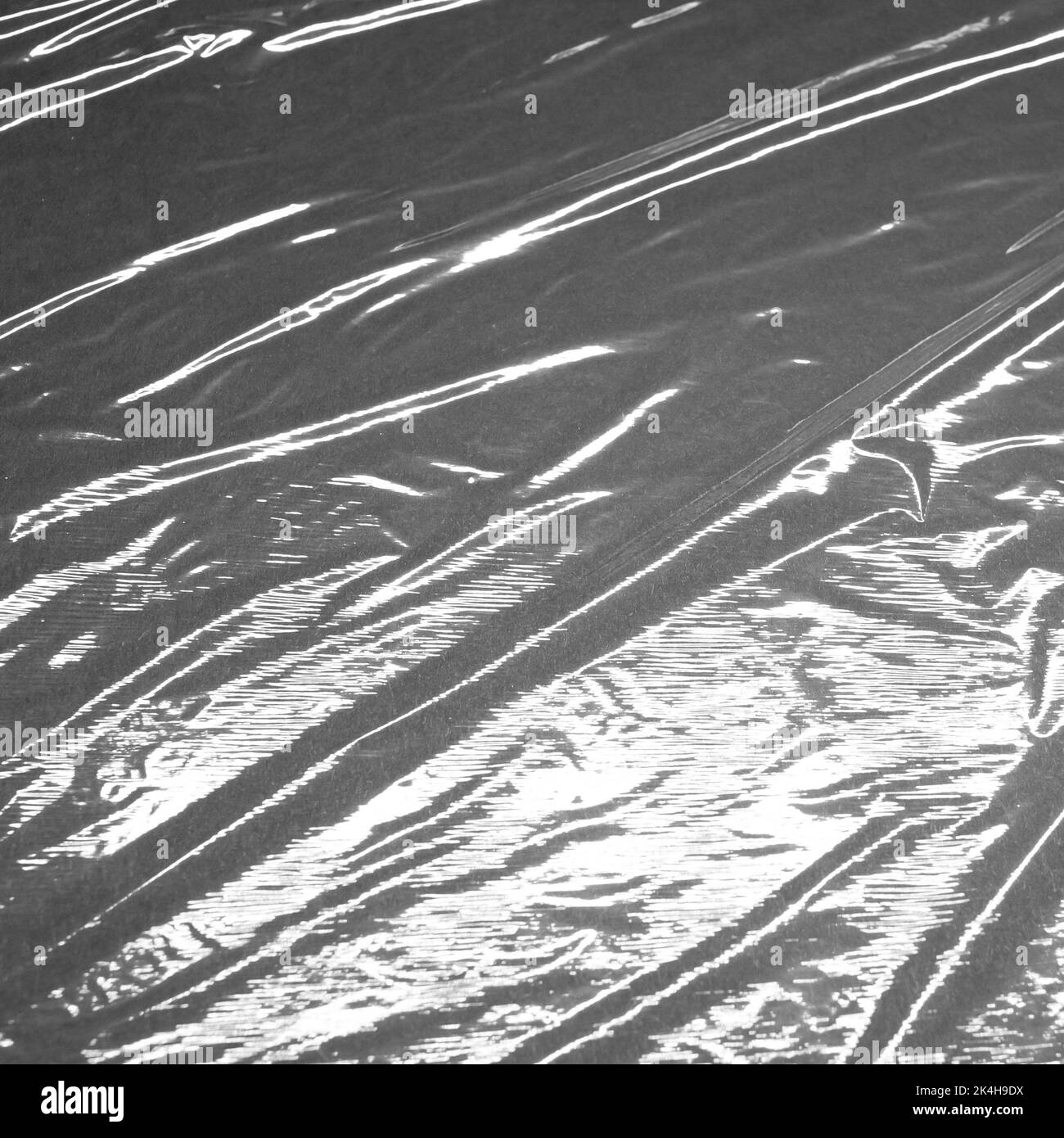 Reflecting light and shadow on creases and folds in shiny fabric or