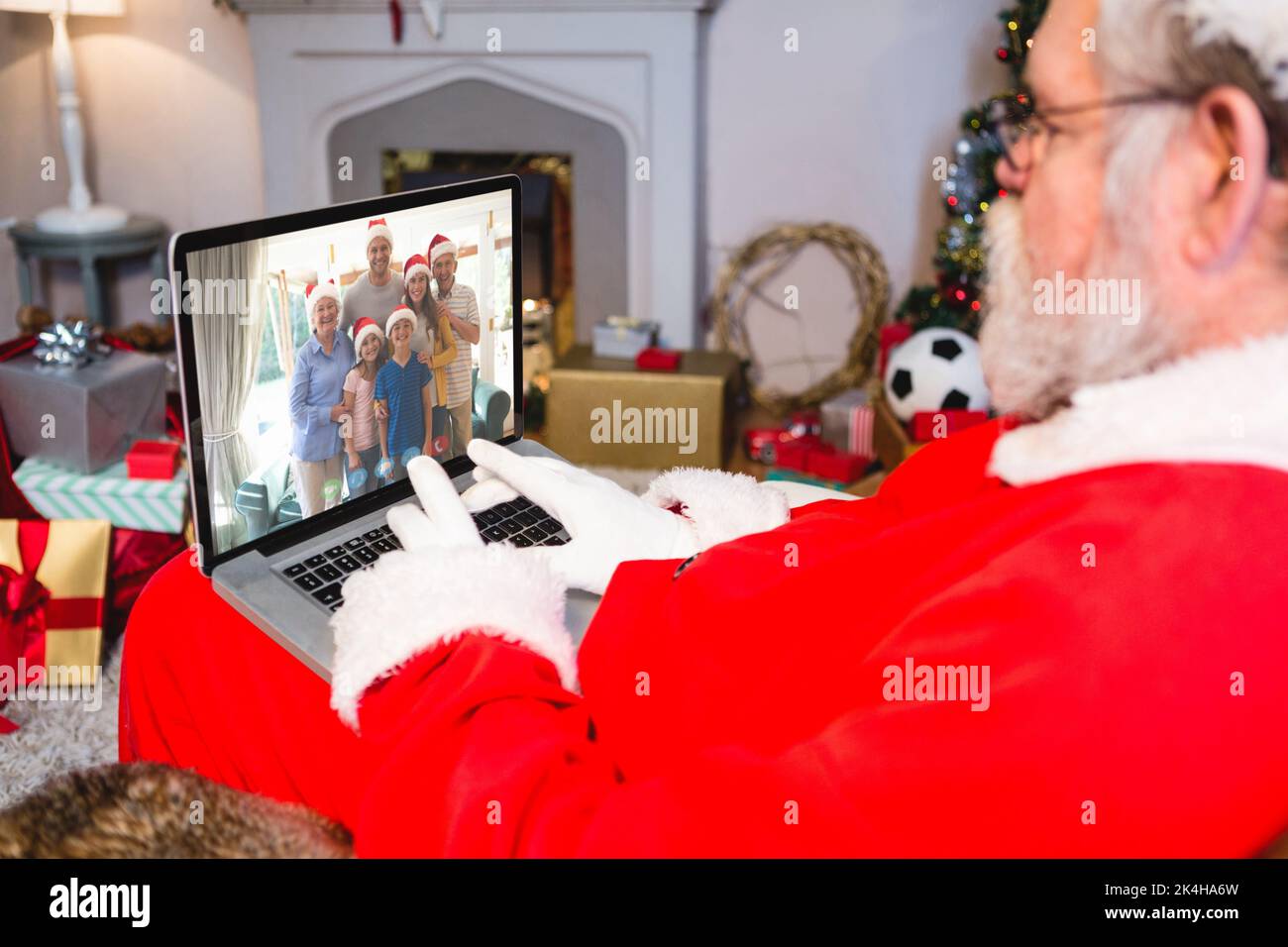 Santa claus making laptop christmas video call with smiling multi ...