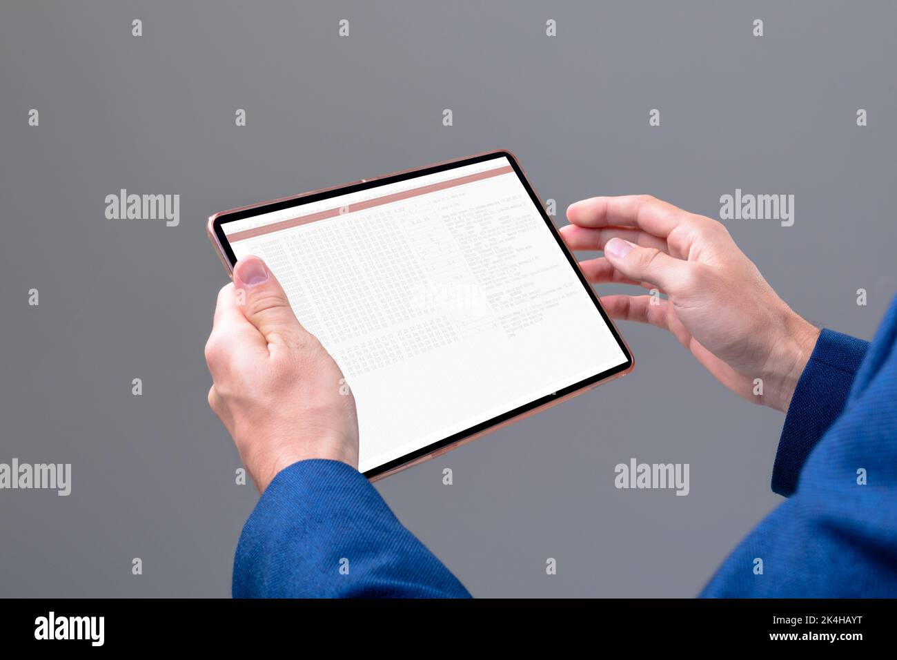 Hands of caucasian male programmer using tablet with coding on screen. coding, programming and computer technology digital composite image. Stock Photo