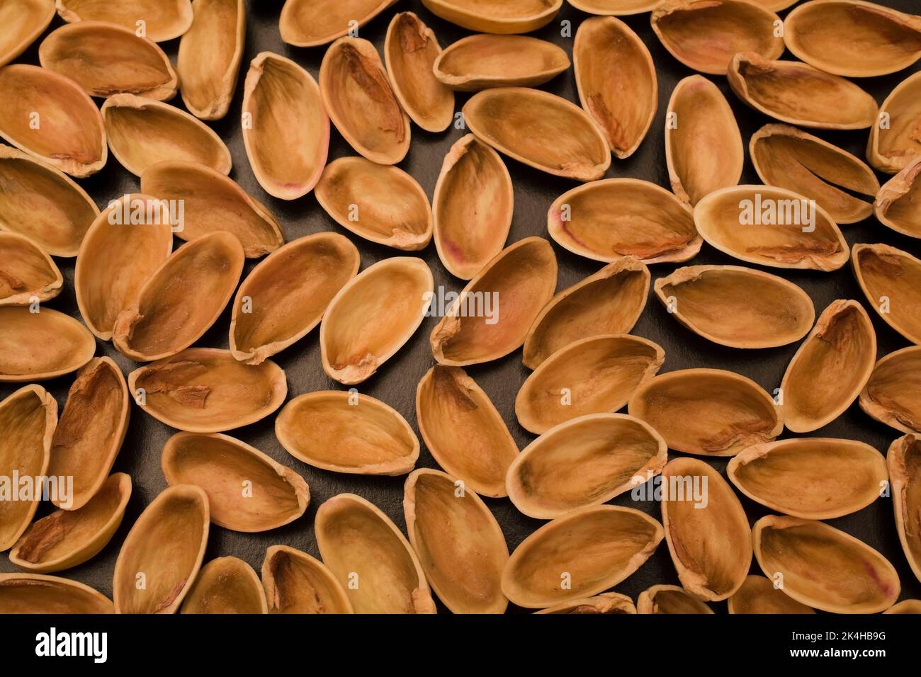 Pistacia vera Pistachio shells on a black background Stock Photo Alamy