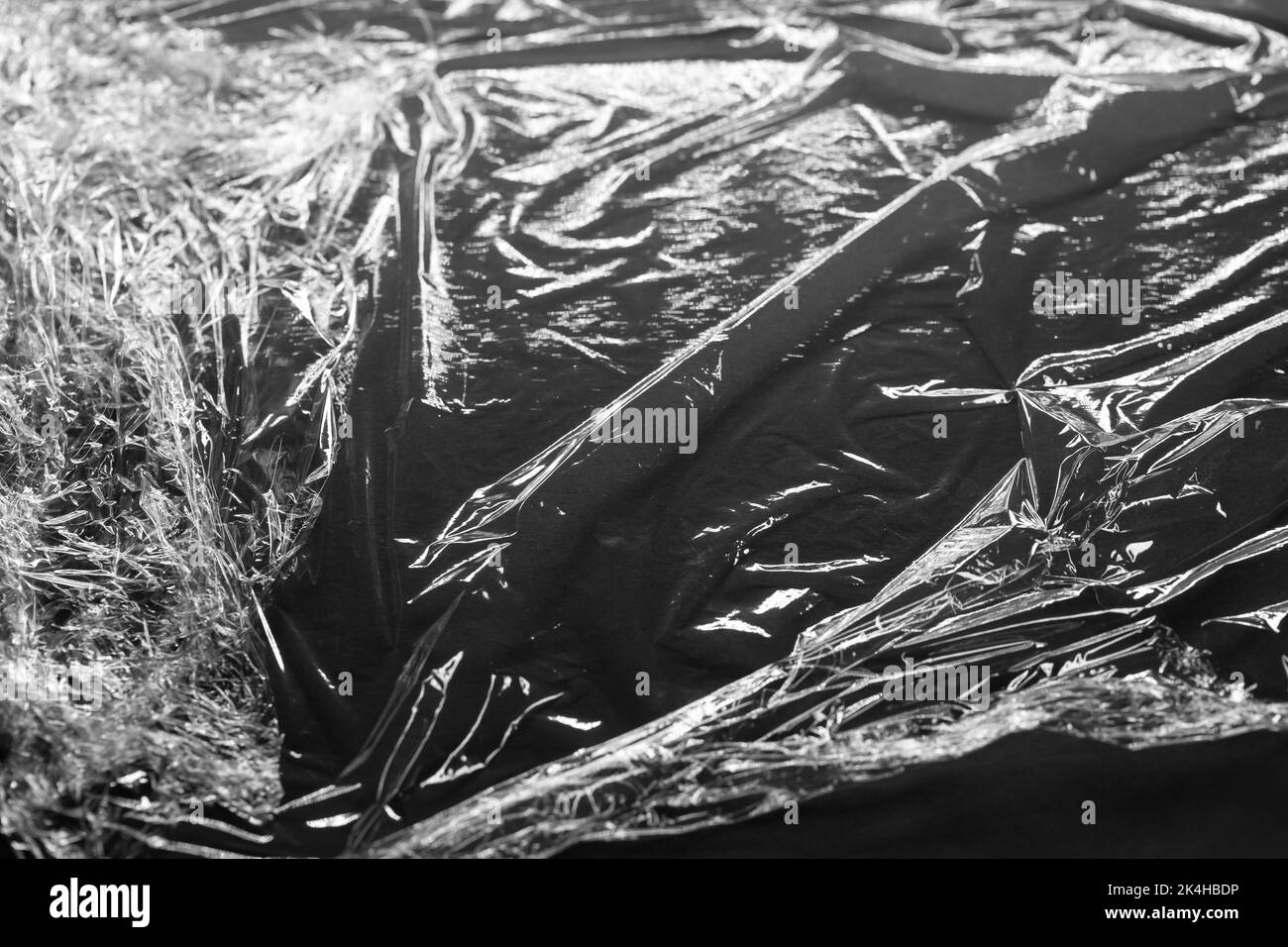 Reflecting light and shadow on creases and folds in plastic foil on