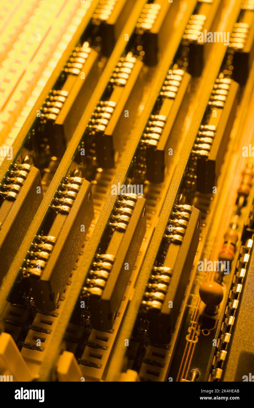 Yellow computer circuit board components. Stock Photo