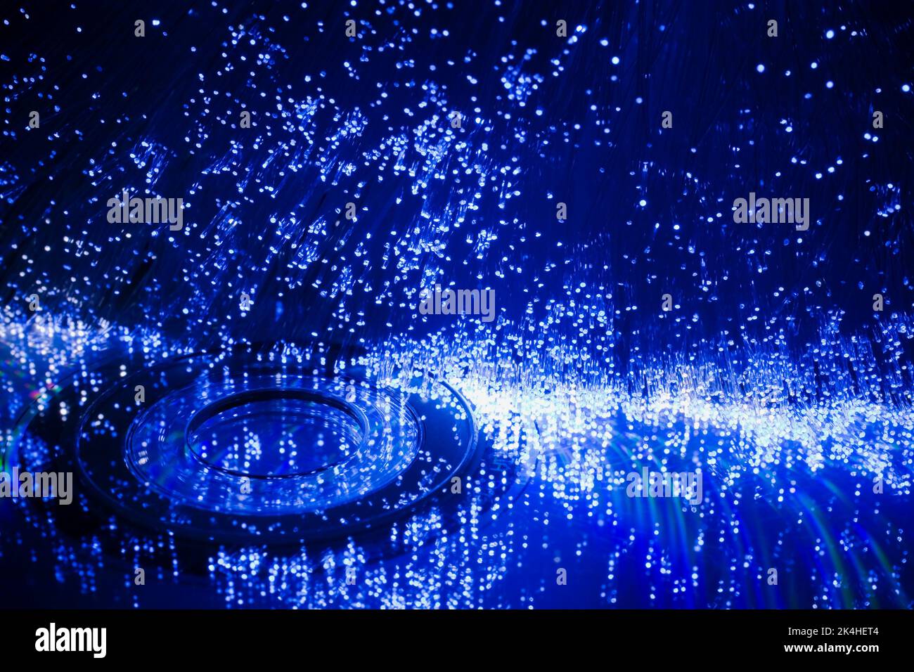 Fibre optic strands and DVD disk. Stock Photo