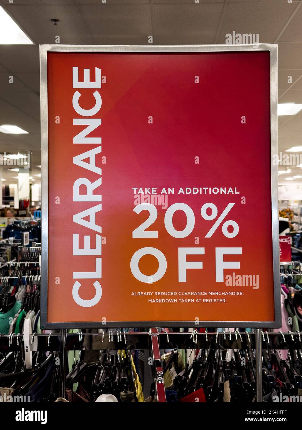Red clearance sales sign at department store, 20 percent off Stock Photo